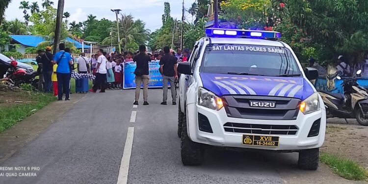 Sat Lantas Polres Sarmi Amankan Jalur dan Kawal Rangkaian Hari Ikan Nasional XII di Kota Sarmi