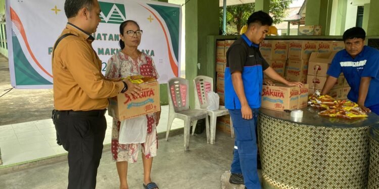 Sinergi Kodim 1310/Bitung Dan PT. Agro Makmur Raya (AMR) Gelar Aksi Sosial Bagi-Bagi Sembako